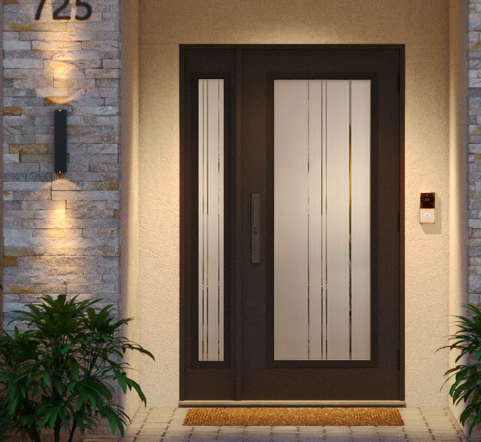 A modern entry door with tall glass panels is framed by a stone wall, warmly lit to reflect the charm of Tampa Bay. A security camera and doorbell are on the right side. Two small plants sit by the entrance on a checkered walkway, beneath house number 725 on the wall.